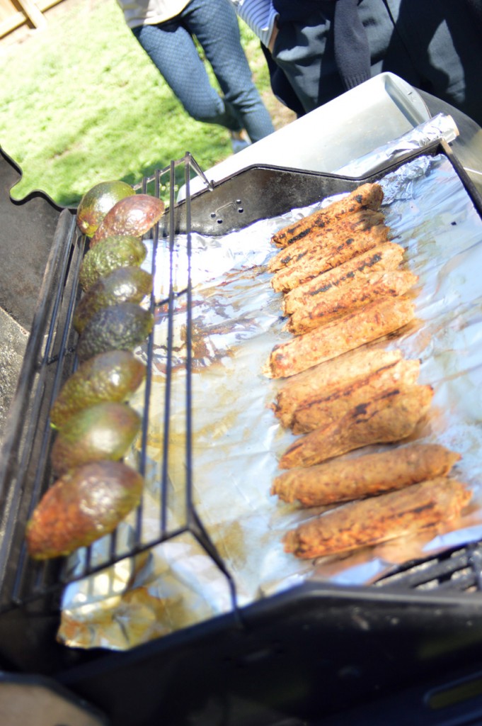 avocado and bratwurst on the grill