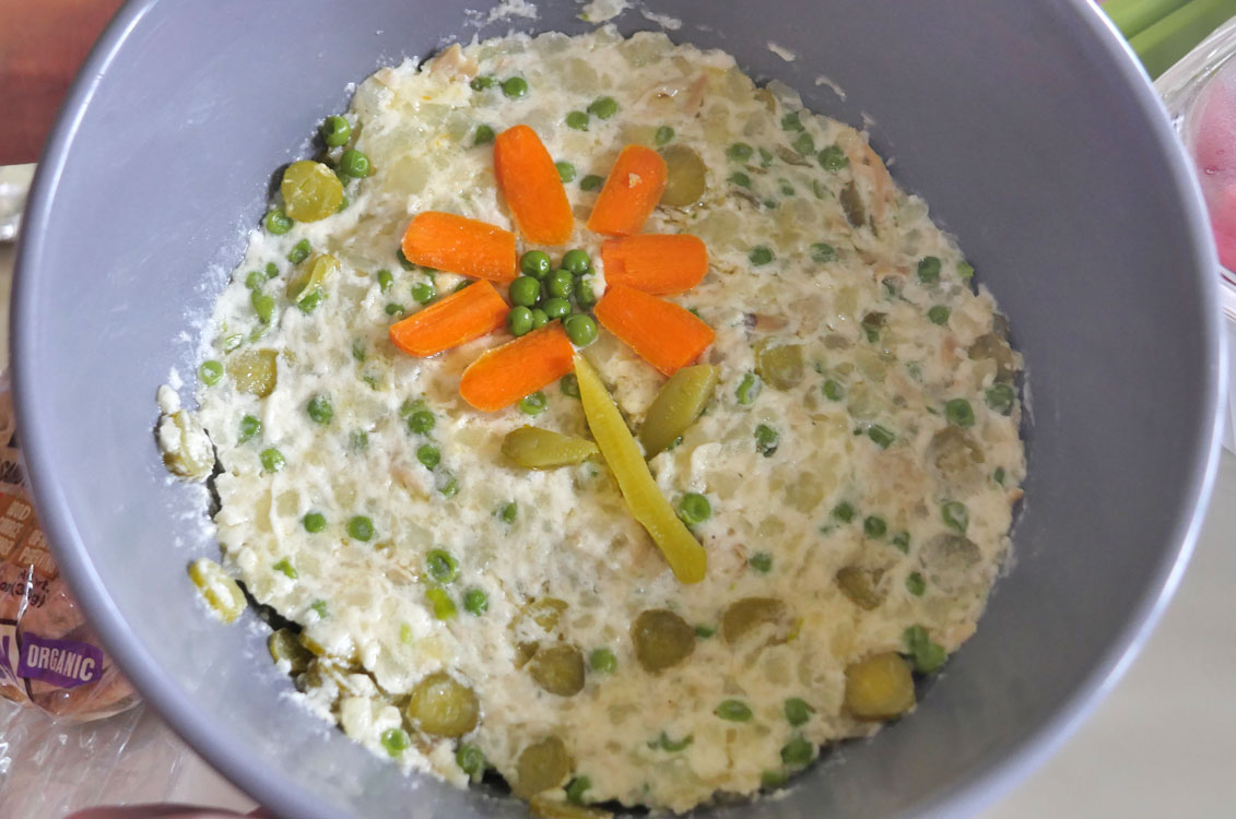 Salad Olivier with flower decoration