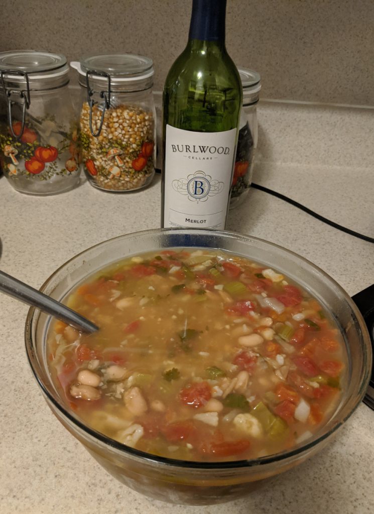 Bowl of beans and wine bottle