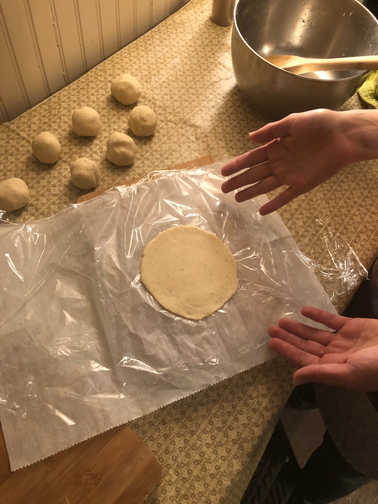 pressing corn tortillas