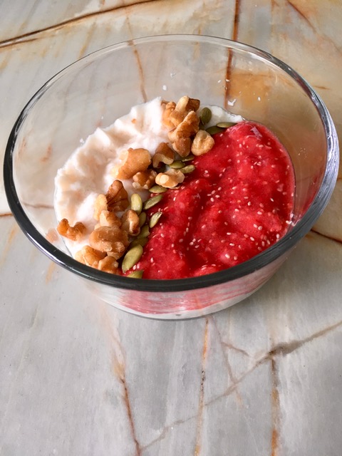 homemade vegan yogurt with strawberry and chia seed purée, pumpkin seeds, and walnuts