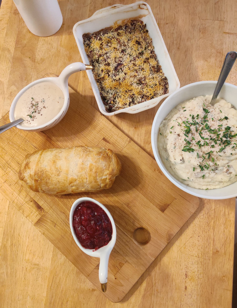 gravy boat, field roast, cranberry sauce, mashed potatoes, green bean casserole