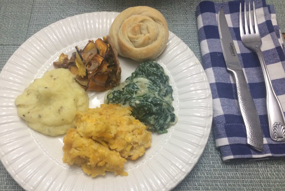 vegan butter rolls, creamed spinach, corn casserole, mashed potatoes, squash and onion tart