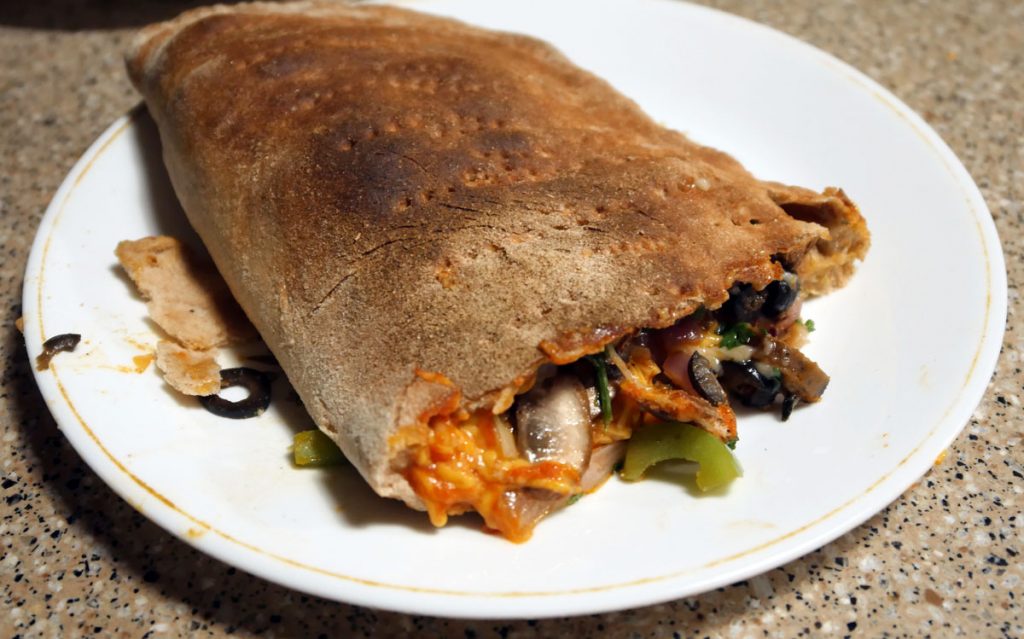 vegan calzone baked and cut open