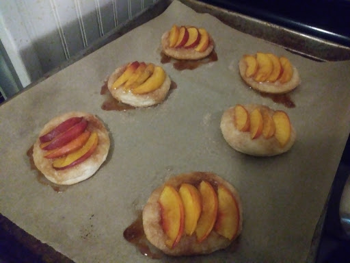 six peach biscuits on a tray