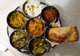steel dish of vegan Indian food