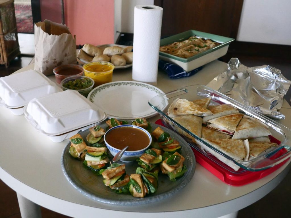 table of vegan wraps, stacks, and rolls