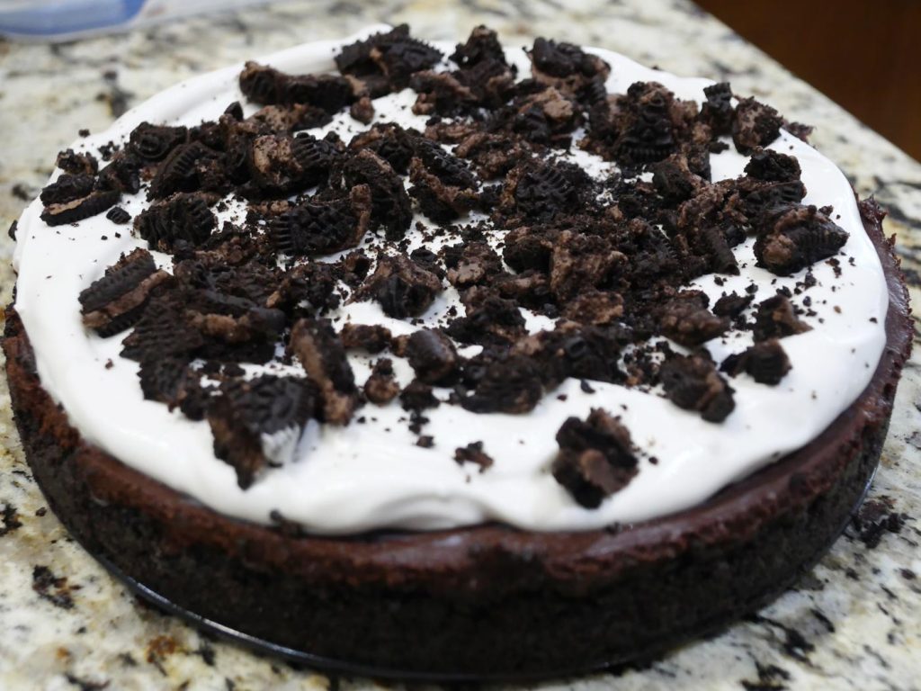 vegan chocolate pie with coconut whipped cream and oreos