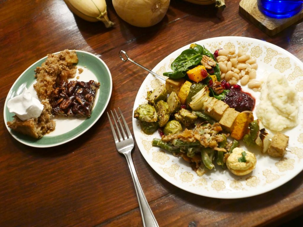 plate of vegan Thanksgiving food plus a smaller dessert plate