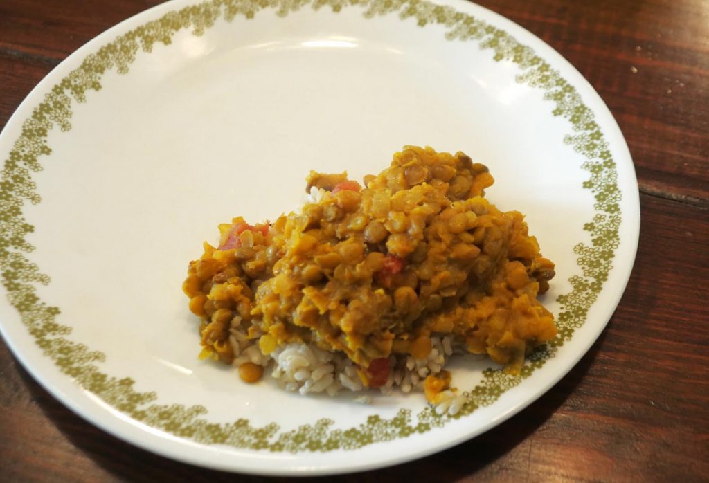 lentil dahl over rice on plate