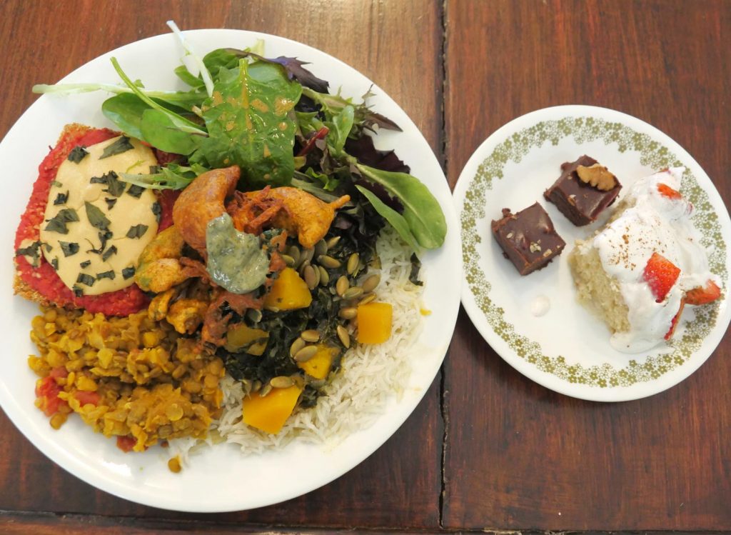 large and small plate of vegan food