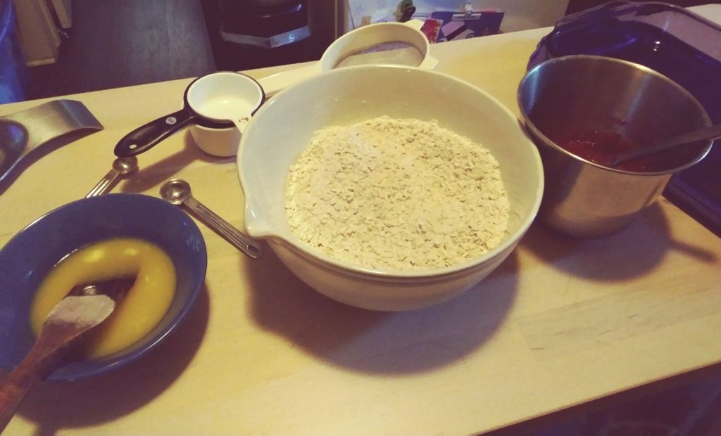 Three bowls with prepared ingredients prior to mixing