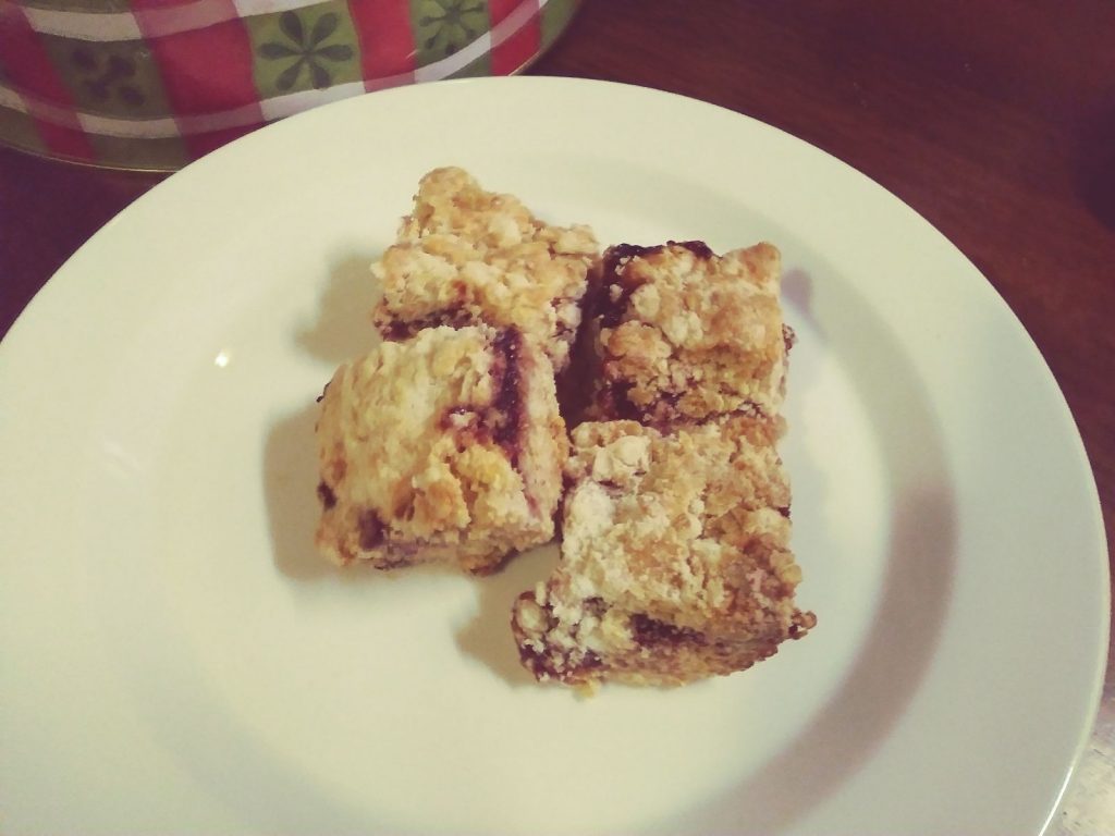 Four cut fruit bars on a white plate