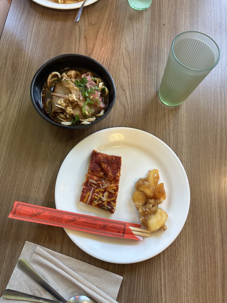 plate of food with chopsticks and bowl 